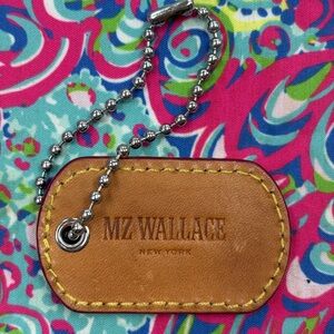 MZ Wallace Silver Bag Charm with New York Address on it